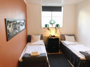 Postel nebo postele na pokoji v ubytování Spirans Rum och Logi