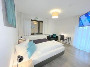 Postel nebo postele na pokoji v ubytování Hotel Hegemann garni