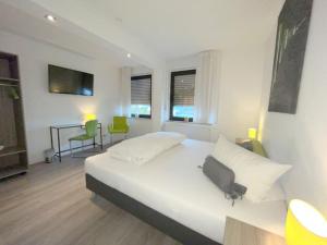 Postel nebo postele na pokoji v ubytování Hotel Hegemann garni
