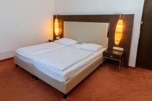 Postelja oz. postelje v sobi nastanitve Hotel Plattenwirt