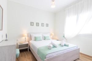 Posteľ alebo postele v izbe v ubytovaní Hestia Harmony Living