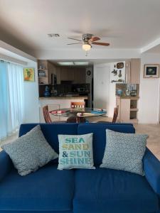 a blue couch with pillows on it in a living room at Breathtaking Oceana Del Mar in Rosarito