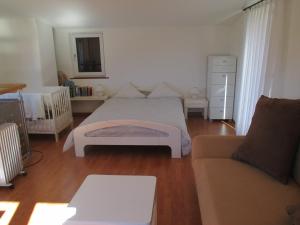 En eller flere senge i et værelse på Ferienhaus La Torre