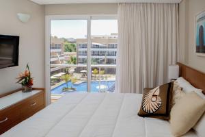 Ένα ή περισσότερα κρεβάτια σε δωμάτιο στο Hotel Margarita Real
