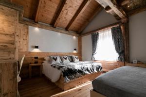Postel nebo postele na pokoji v ubytování B&B Il Tabià