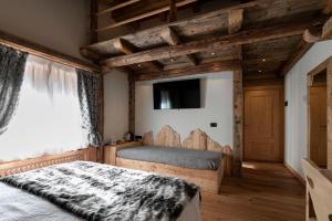 Postel nebo postele na pokoji v ubytování B&B Il Tabià