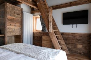 Postel nebo postele na pokoji v ubytování B&B Il Tabià