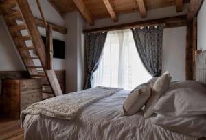 Postel nebo postele na pokoji v ubytování B&B Il Tabià