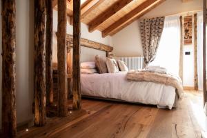 Postel nebo postele na pokoji v ubytování B&B Il Tabià