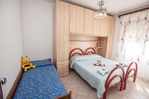 Een bed of bedden in een kamer bij Apartments in Rosolina Mare 25088