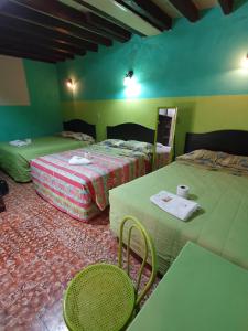 Llit o llits en una habitació de Hotel Kasa Kamelot Central