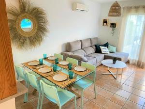 a living room with a table and chairs and a couch at Gust De Sal in Denia