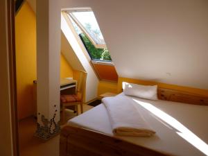 a bedroom with a bed with a large window at Gasthof Hotel Traube in Oberndorf