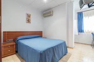 Postel nebo postele na pokoji v ubytování Hotel Reig