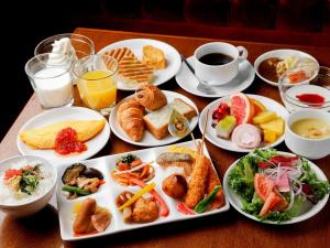 plates of food on a table at Fraser Residence Nankai Osaka in Osaka