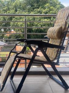 a chair sitting on top of a balcony at Elegant84 in Johannesburg