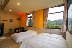 Postel nebo postele na pokoji v ubytování New Live B&B