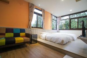Postel nebo postele na pokoji v ubytování New Live B&B