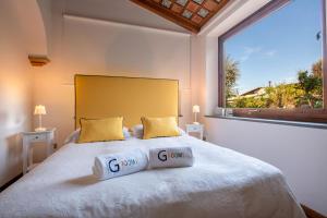 Łóżko lub łóżka w pokoju w obiekcie Suite Lidia B&B