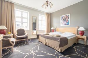 Postel nebo postele na pokoji v ubytování Hotel Dania + 37 fotografií