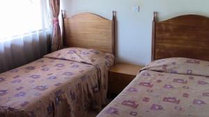 Ένα ή περισσότερα κρεβάτια σε δωμάτιο στο Klique Hotel Eldoret