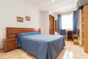 Postel nebo postele na pokoji v ubytování Hotel Reig