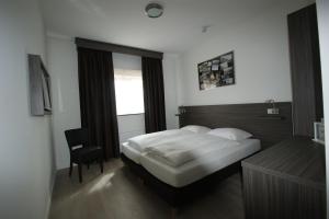 Postelja oz. postelje v sobi nastanitve Hotel de Keizerskroon Amsterdam-Schiphol-Halfweg