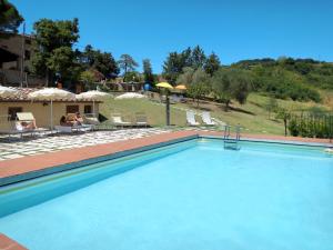 The swimming pool at or close to Apartment Villa Caggio-1 by Interhome