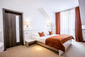 Postel nebo postele na pokoji v ubytování Hotel Olberg + 24 fotografií