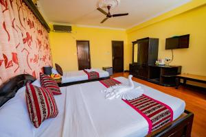 Katil atau katil-katil dalam bilik di Hotel Bougainvillea +37 gambar