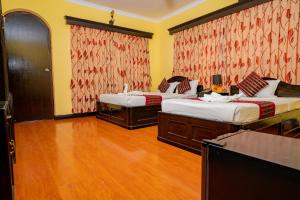 Una cama o camas en una habitación de Hotel Bougainvillea