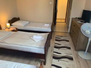 Krevet ili kreveti u jedinici u okviru objekta Aranykorona Hotel
