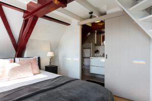 Postel nebo postele na pokoji v ubytování B&B Parijs aan de Kaai