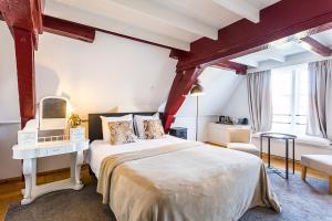 Postel nebo postele na pokoji v ubytování B&B Parijs aan de Kaai