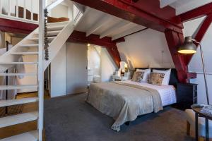 Postel nebo postele na pokoji v ubytování B&B Parijs aan de Kaai