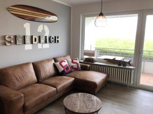 a living room with a couch and a table at Seedeich in Cuxhaven