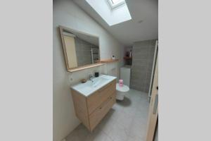 Koupelna v ubytování Appartement neuf tout confort + 25 fotografií