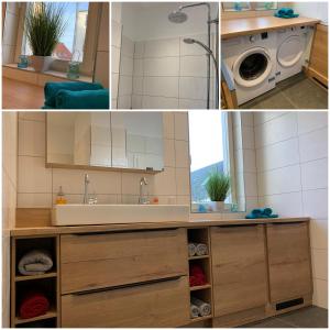 a kitchen with a sink and a washing machine at MEERzeit-Norderney in Norderney