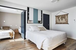מיטה או מיטות בחדר ב-Villa Mélusine