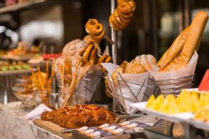 a buffet with various types of bread and pastries at InterContinental Nanjing, an IHG Hotel in Nanjing