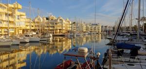a marina with alot of boats in the water at La Luna Blanca in Torremolinos