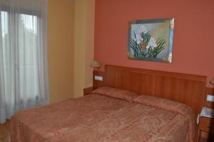 Postel nebo postele na pokoji v ubytování Hostal Quevedo