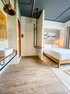 Postel nebo postele na pokoji v ubytování Bedgasm Hostel Chanthaburi