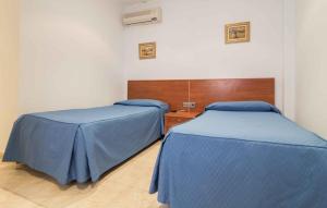 Postel nebo postele na pokoji v ubytování Hotel Reig