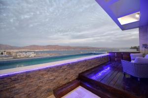 a balcony with a view of the water at Private pool Luxury penthouses sea view Eilat in Eilat