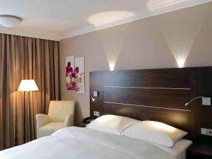 Giường trong phòng chung tại Mercure Hotel Hagen