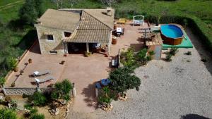 an aerial view of a house with a swimming pool at Finca Can Titos in Llucmajor