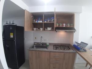 Η κουζίνα ή μικρή κουζίνα στο Aparta-Hotel Cafetero Oviedo