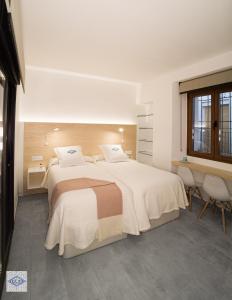 Säng eller sängar i ett rum på Ágora Casa