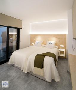 Säng eller sängar i ett rum på Ágora Casa